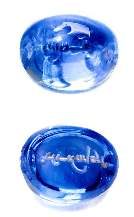 A HIGHLY IMPORTANT SAPPHIRE SEAL WITH KUFIC INSCRIPTION (HARITH IBN SHAKIR)