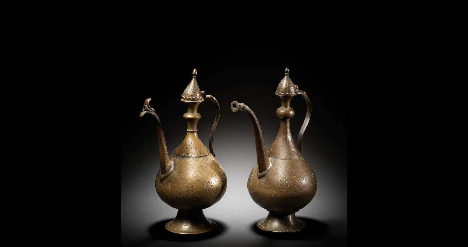 TWO MUGHAL BRASS EWERS