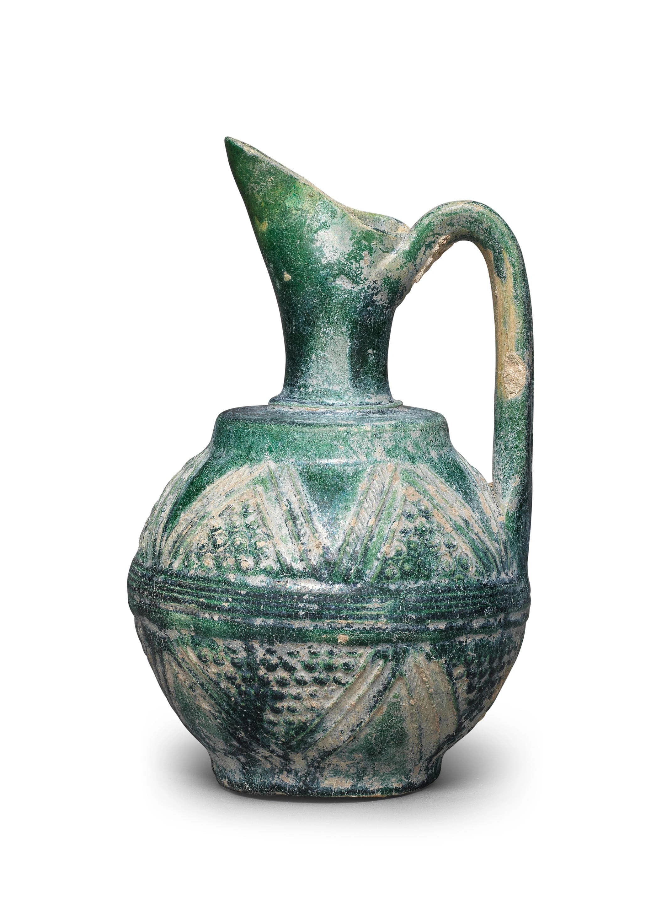 AN UMAYYAD MONOCHROME MOULDED POTTERY EWER