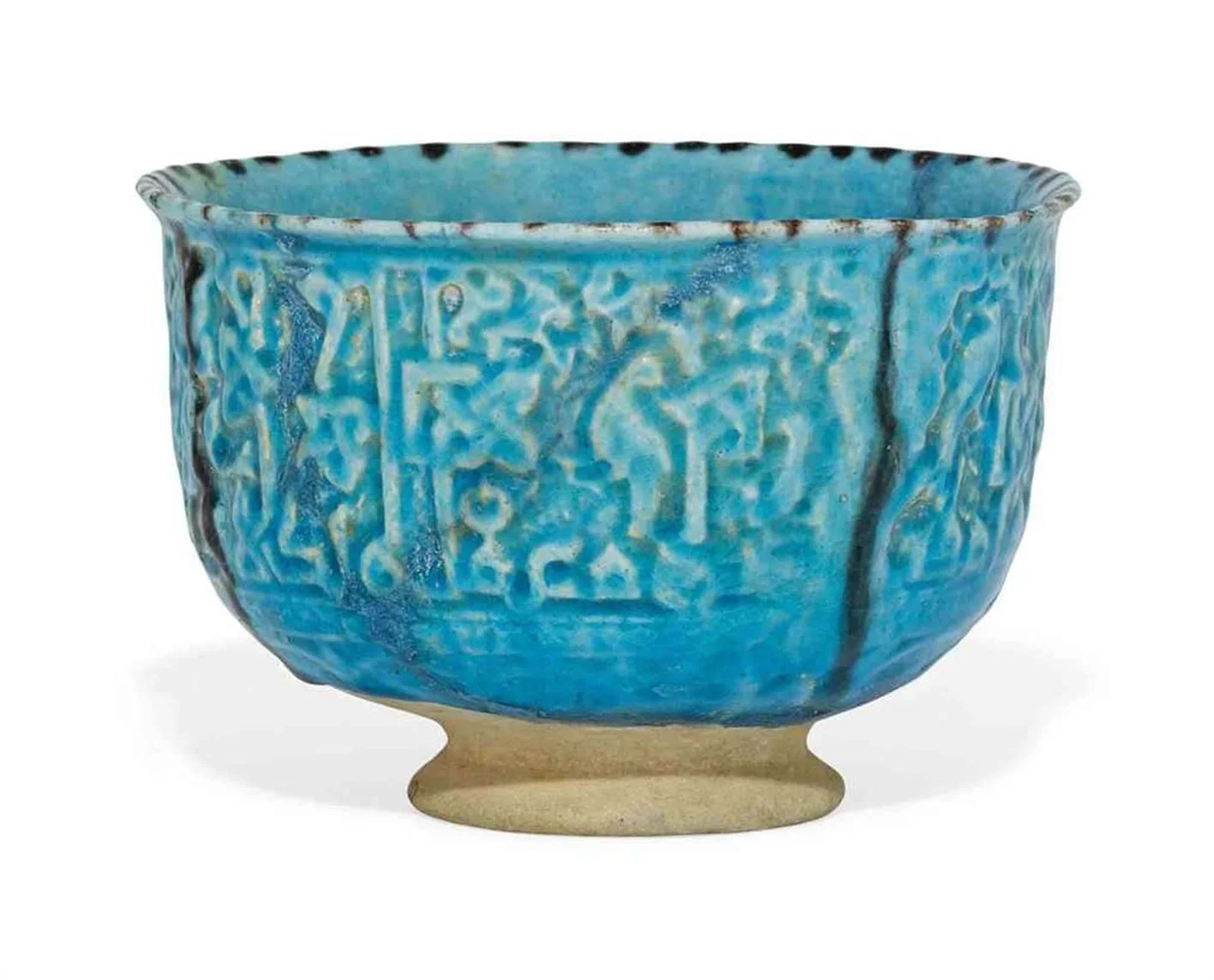 FRITWARE BOWL WITH MOULDED DECORATION IN RELIEF UNDER A TURQUOISE GLAZE