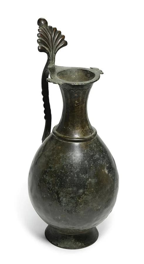AN EARLY ISLAMIC BRONZE EWER