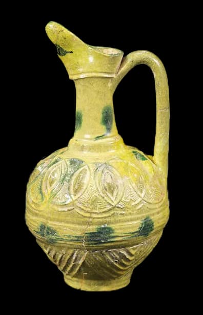 AN UMAYYAD SPLASHWARE MOULDED POTTERY EWER