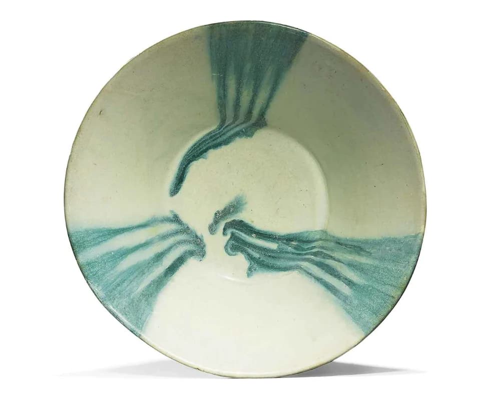 A GREEN-SPLASHED CONICAL POTTERY BOWL