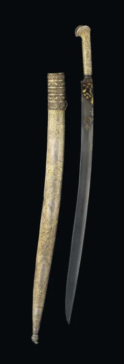 A REPOUSSÉ SILVER-GILT MOUNTED SHORT SWORD (YATAGHAN)