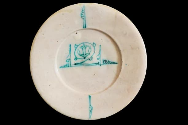AN ABBASID TIN GLAZED POTTERY DISH