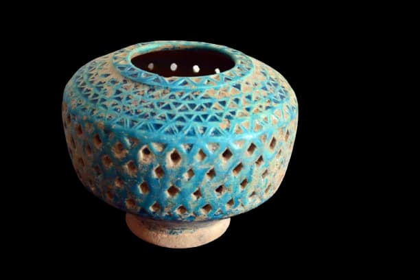 A KASHAN TURQUOISE POTTERY OPENWORK VASE