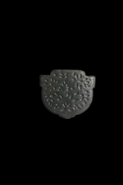 A TIMURID CARVED JADE PENDANT